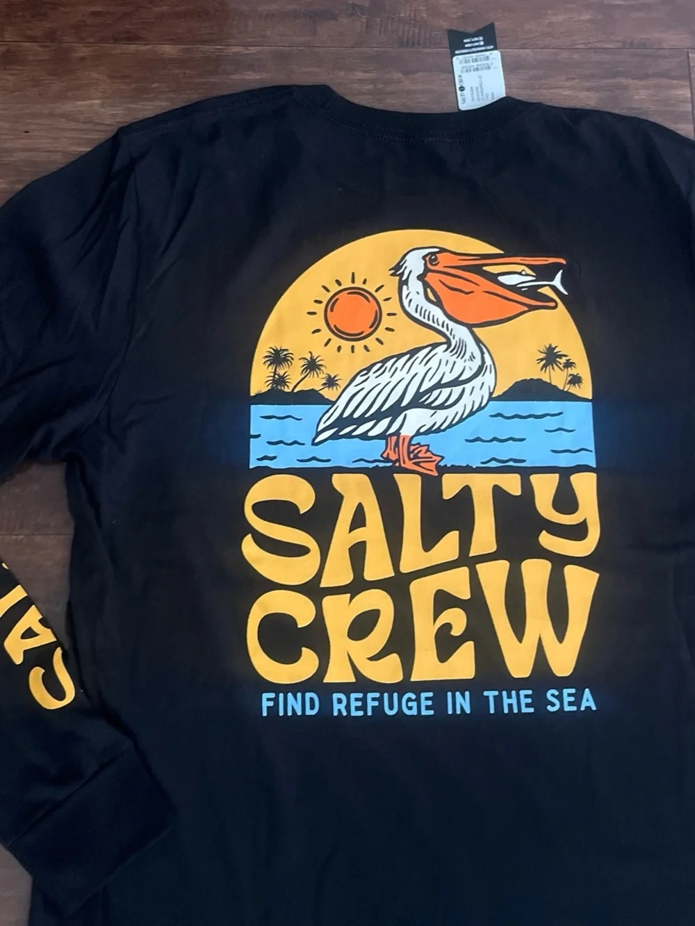 Salty Crew Black Long Sleeve Swim Tee with Yellow & Blue Pelican Graphic